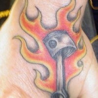 Brightly burning iron object hand tattoo