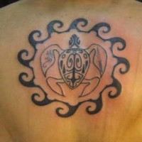 Black tribal turtle tattoo in circle of waves