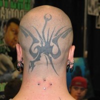 Head tattoo with black, flying monster dragon