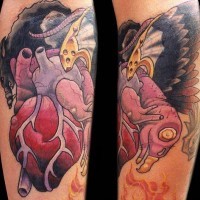 Realistic heart with vulture tattoo in colour