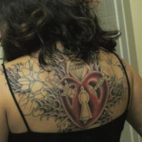 Large incomplete heart themed tattoo on back