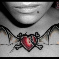 Broken heart with bat wings on chest