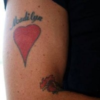 Lover name and red heart tattoo