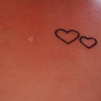 Two black line hearts tattoo