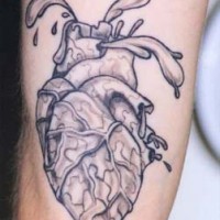 Realistic heart black ink tattoo