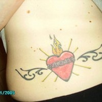 Red flaming heart with tribal tracery on lower back
