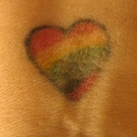 Colourful flag heart tattoo