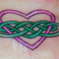 Heart with green tracery tattoo
