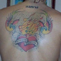 Flaming heart with sparrows tattoo on back