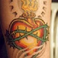 Flaming heart in crown of thorns tattoo