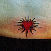 Red heart in shining tattoo