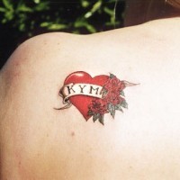 Kym lover name in heart shaped tattoo