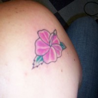 Minimalitic coloured hibiscus tattoo