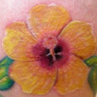 Yellow flower of hibiscus tattoo
