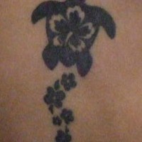 Black turtle with hibiscus flowers tattoo