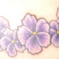 Purple flowers of hibiscus tattoo