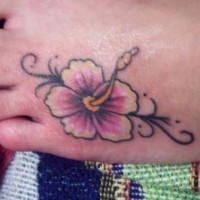 White and pink hibiscus tattoo on foot
