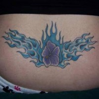 Purple flower in blue flame tracery on lower back