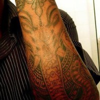 Angry ganesha face tattoo on arm