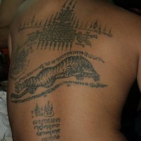 Tibetian writings and tiger full back tattoo