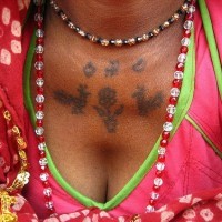 Hindu writings tattoo on chest