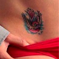 Shouting, colourful, flying bird hip tattoo