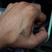 Hand prison tattoo