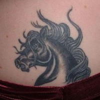 Angry black horse tattoo
