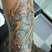 Metallic horse in flame tattoo