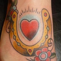 Golden horseshoe and heart classic tattoo