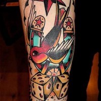 Colourful sparrow dice and horseshoe tattoo