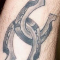 Two horseshoe tattoo