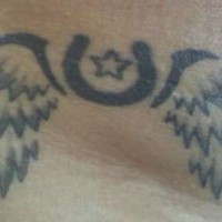 Winged black horseshoe tattoo