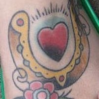 Classic horseshoe with heart tattoo