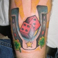 Lucky horseshoe and red dice tattoo