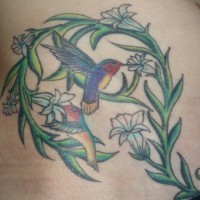Hummingbirds in greens tattoo in colour