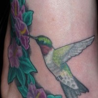 Realistic small hummingbird tattoo