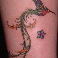 Majestic hummingbird with long tail tattoo