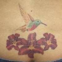 Hummingbird with three flowers tattoo