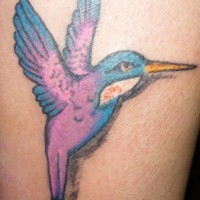 Elegant purple hummingbird tattoo