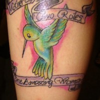Green hummingbird and stripes tattoo