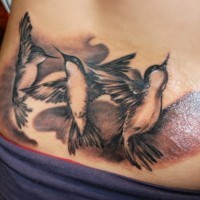 Three black hummingbirds tattoo