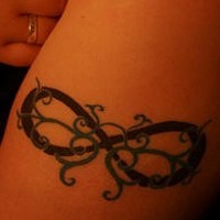 Infinity symbol with tracery tattoo