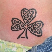 Tribal style clover tattoo