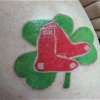 Green shamrock and red socks tattoo