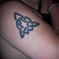 Irish trinity symbol tattoo on shoulder