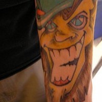 Smiling leprechaun coloured tattoo