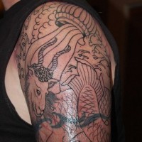 Japanese style tattoo with goat and dragons