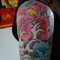 Asiasn style flowers in sea storm tattoo