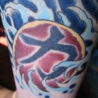 Japanese symbol in sea waves tattoo